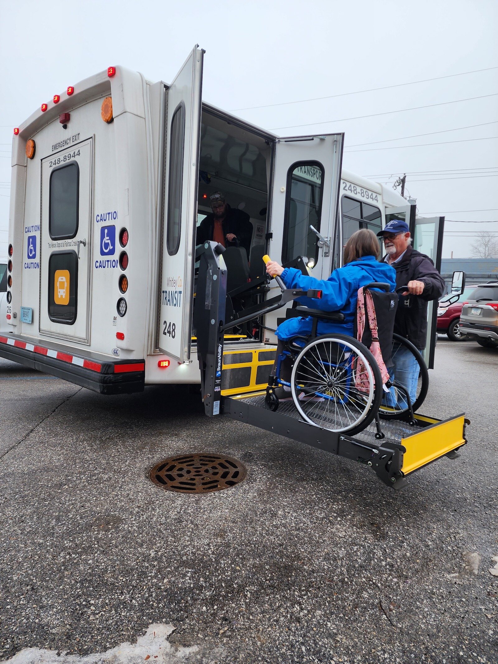 A passenger boards a bus in Whitley County.