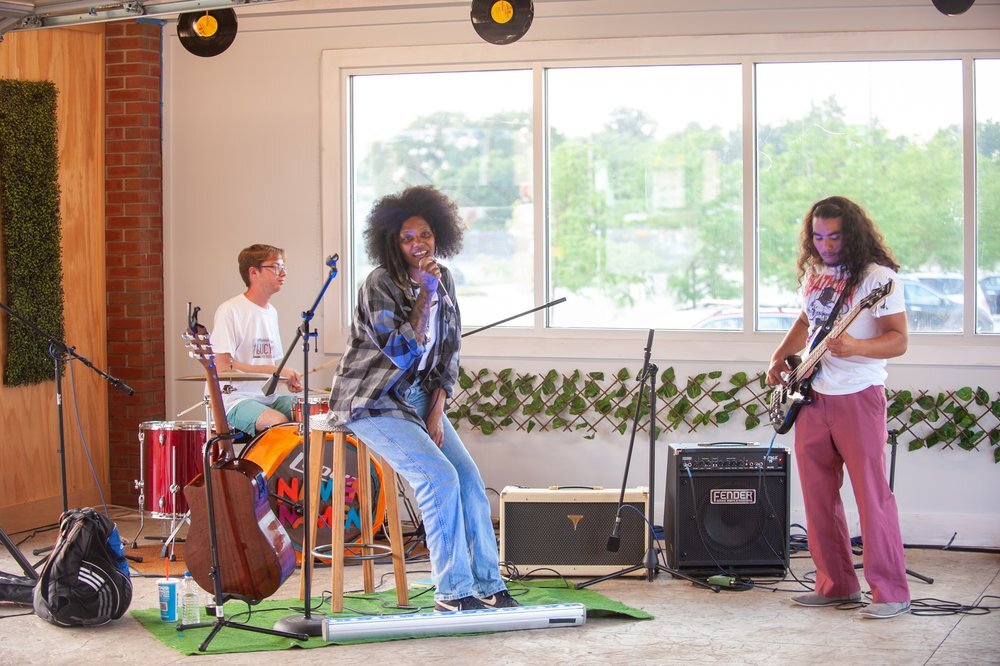 A band performing inside The Garden