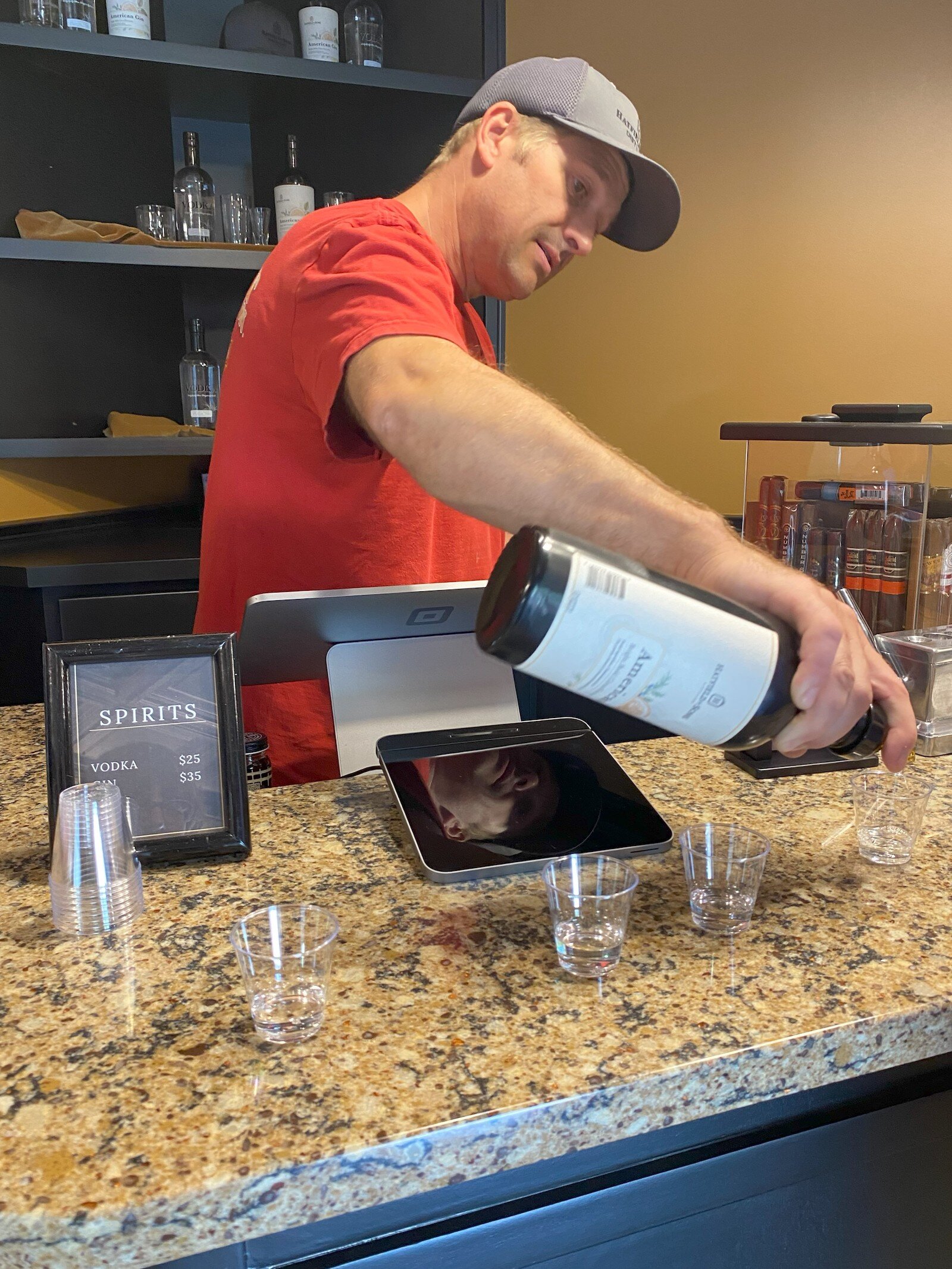 Jake Hatfield pouring gin.