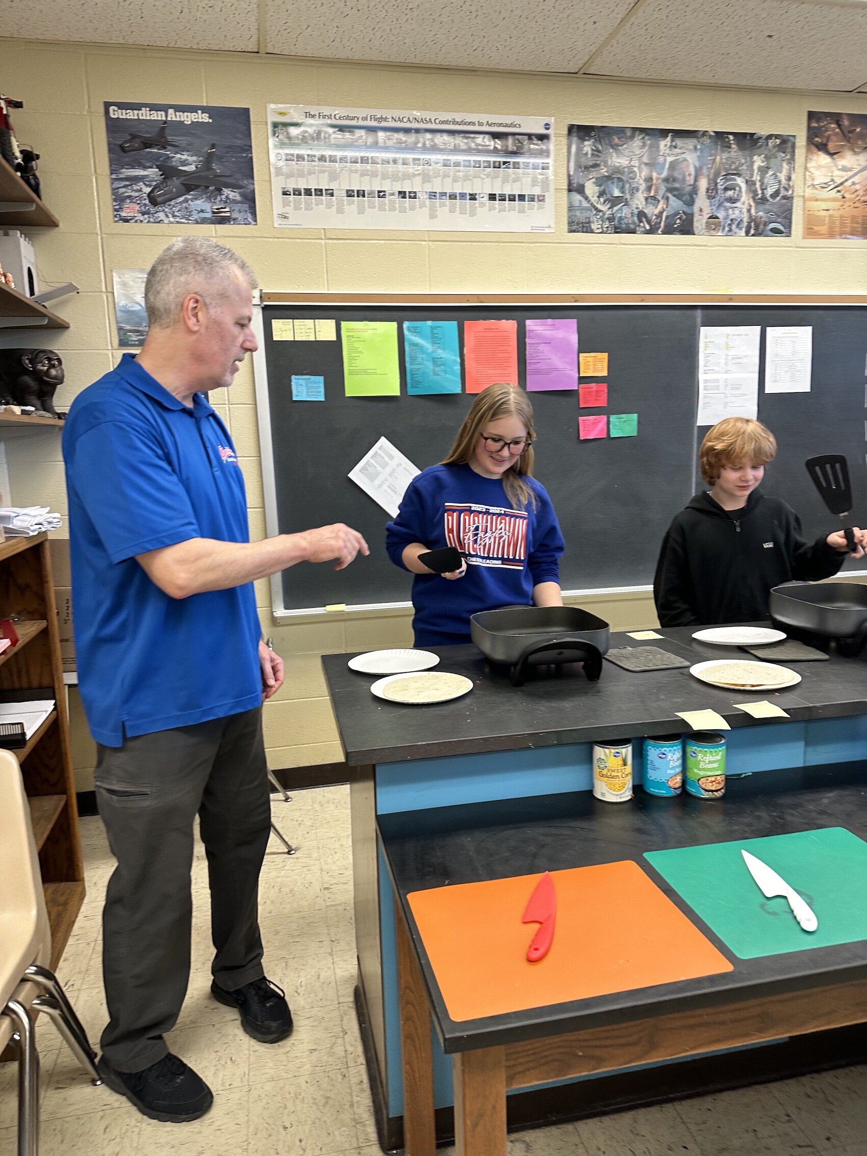 Students in Mr. Larsen's class cook quesadillas as part of the Cooking in the Classroom program.