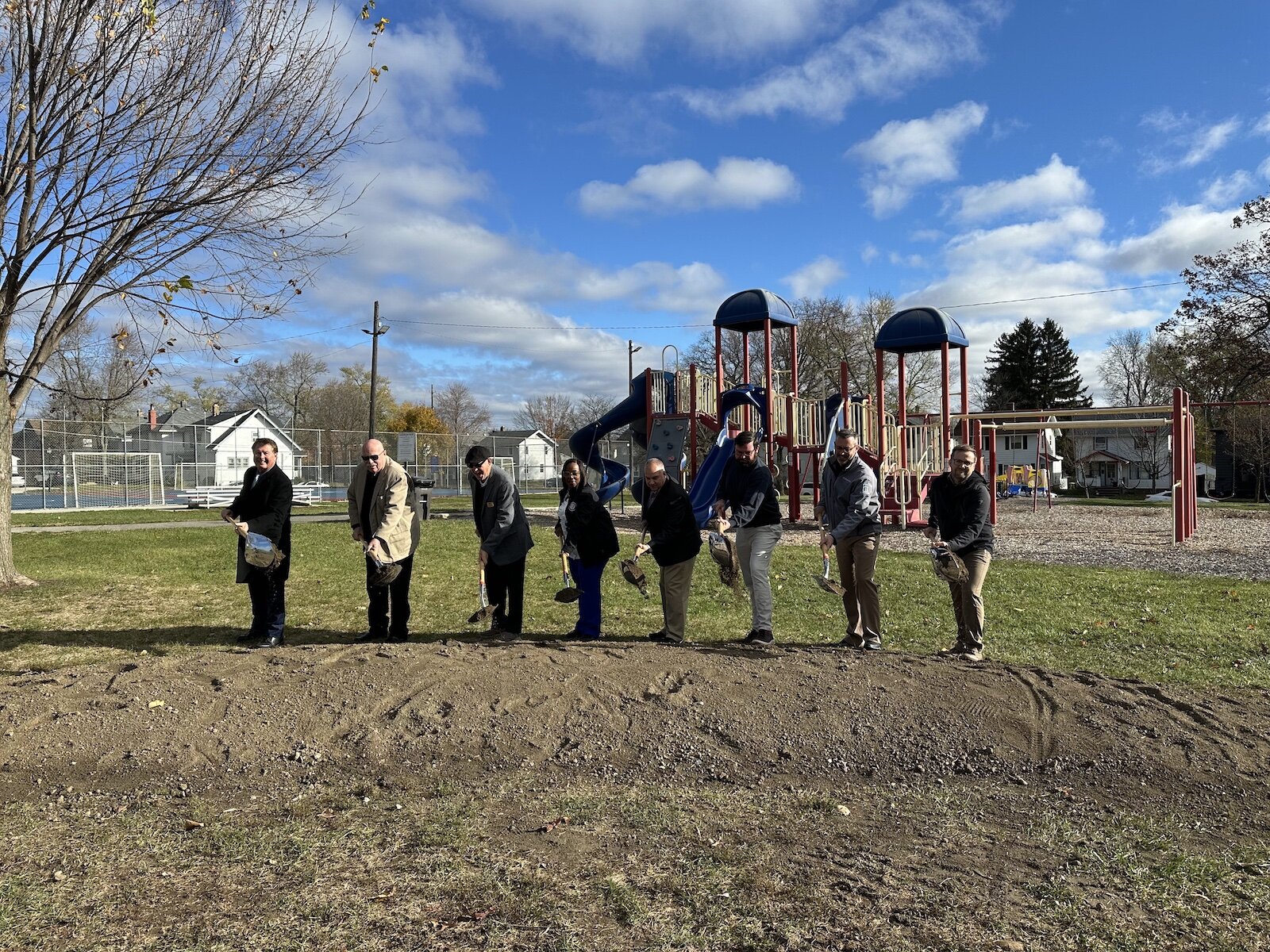 The mayor, councilmen, and parks and recreation department leaders celebrate the groundbreaking of Packard Park.