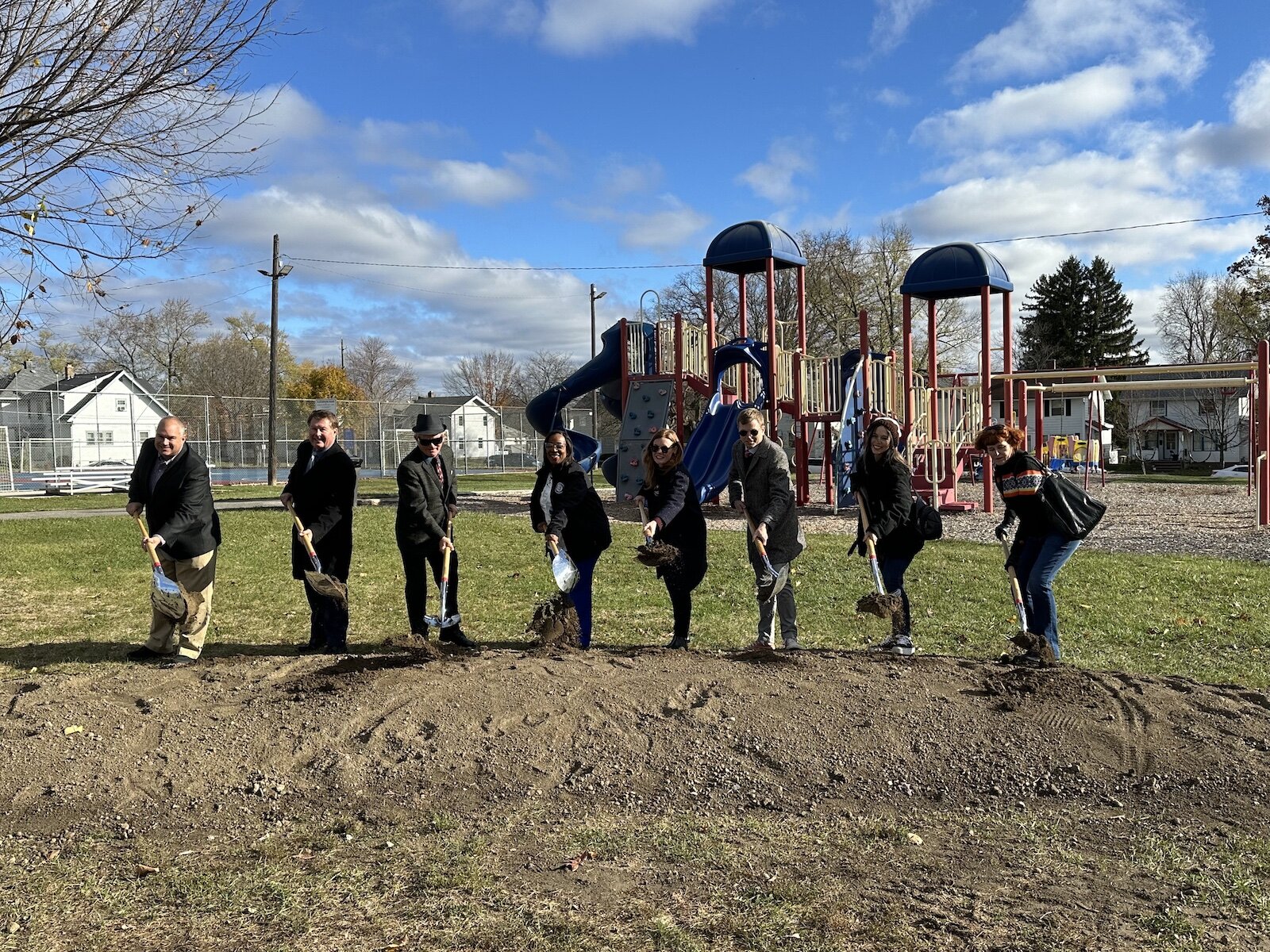 Mayor Sharon Tucker celebrates the groundbreaking of Packard Park with neighborhood residents and Councilmen Bender and Paddock.