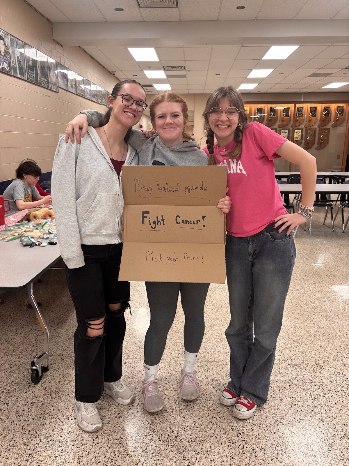 Margaret Wheeler (left) with classmates at the bake sale.