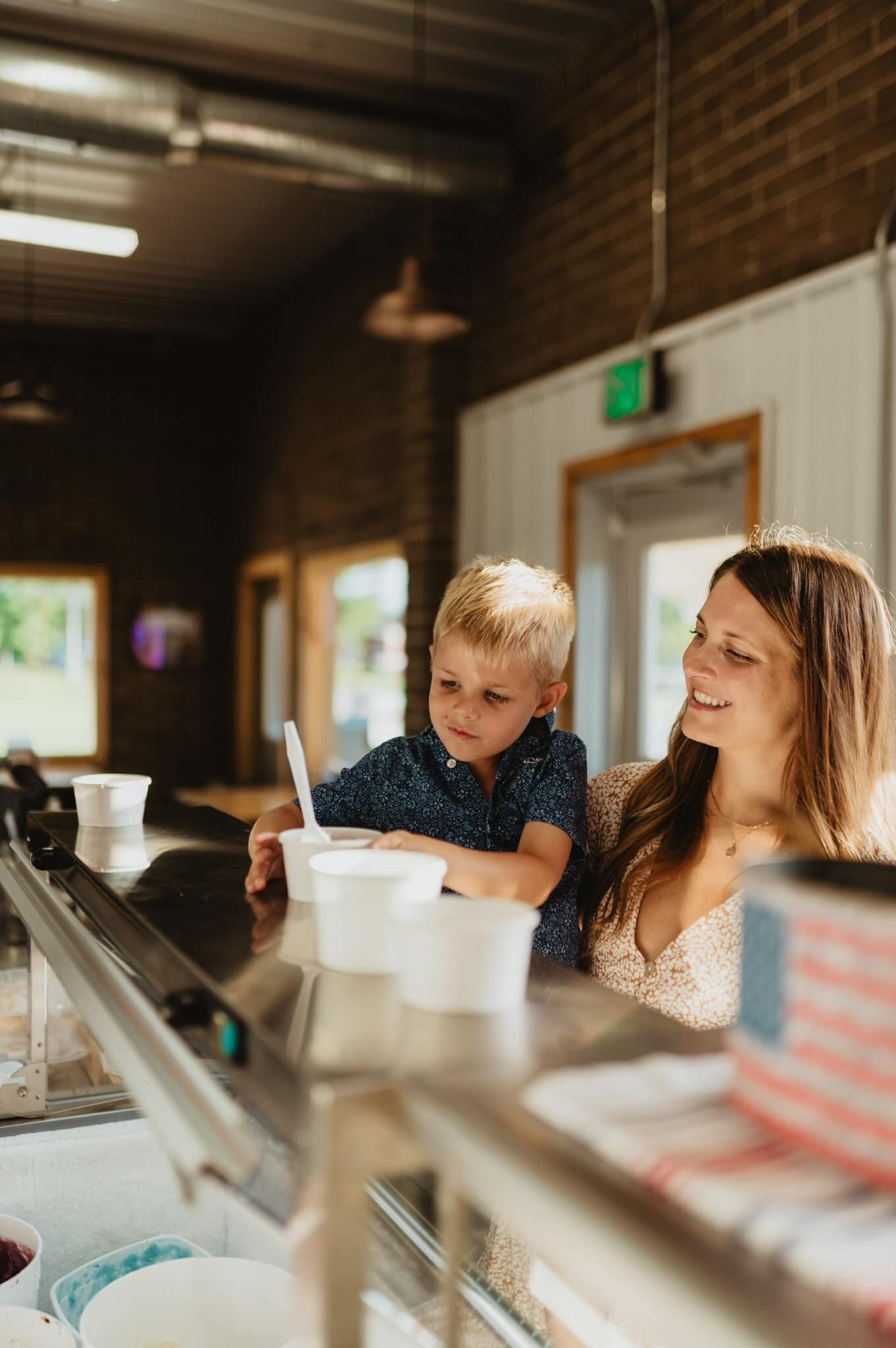 Neil Bever's wife and child ordering at In-Laws Creamery in Roann. 