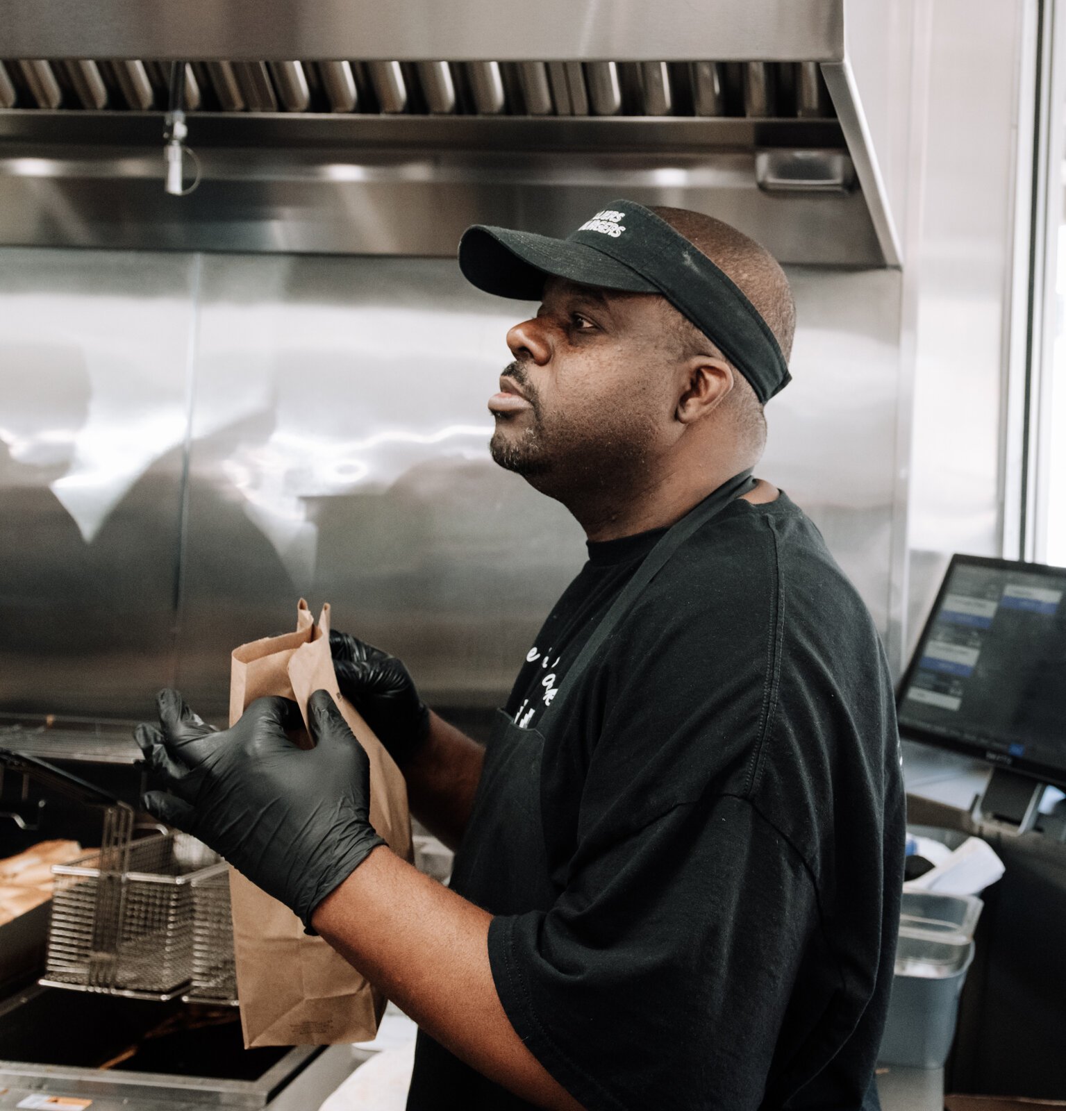 Jovone Wright bags up an order at Powers Hamburgers.