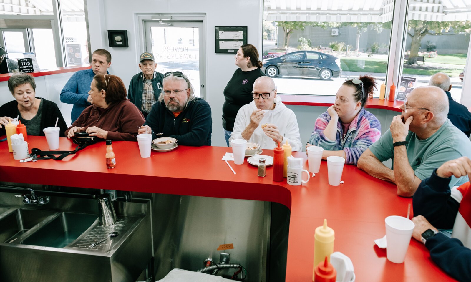 Customer line the counter inside the newly renovated Powers Hamburgers.