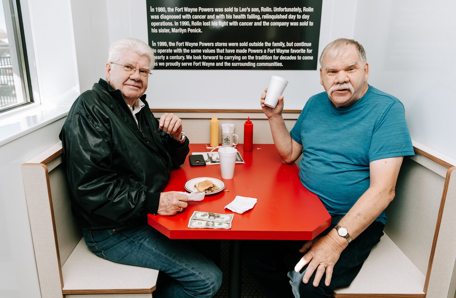 Customers David, left, and Denny Lough eat at the only booth table at Powers Hamburgers on Harrison Street.