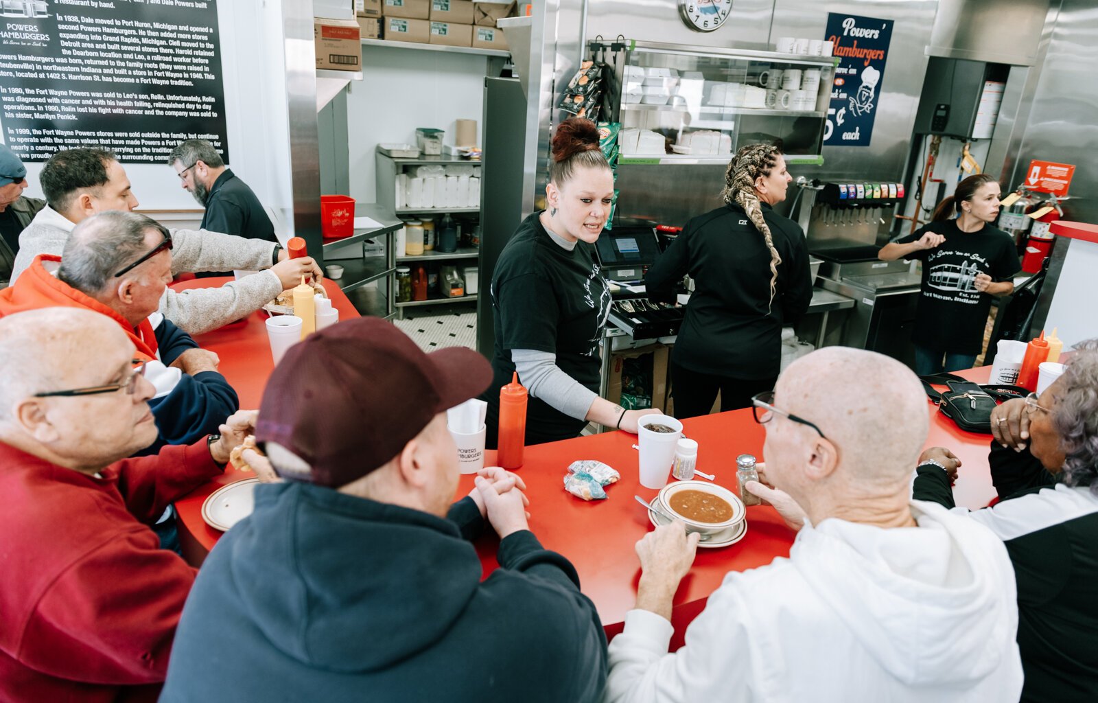 Amber Doan talks to customers at Powers.