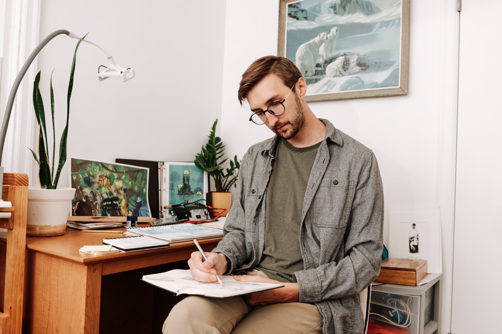 Artist James Newton works on sketching a picture book concept at his home studio in Roanoke.