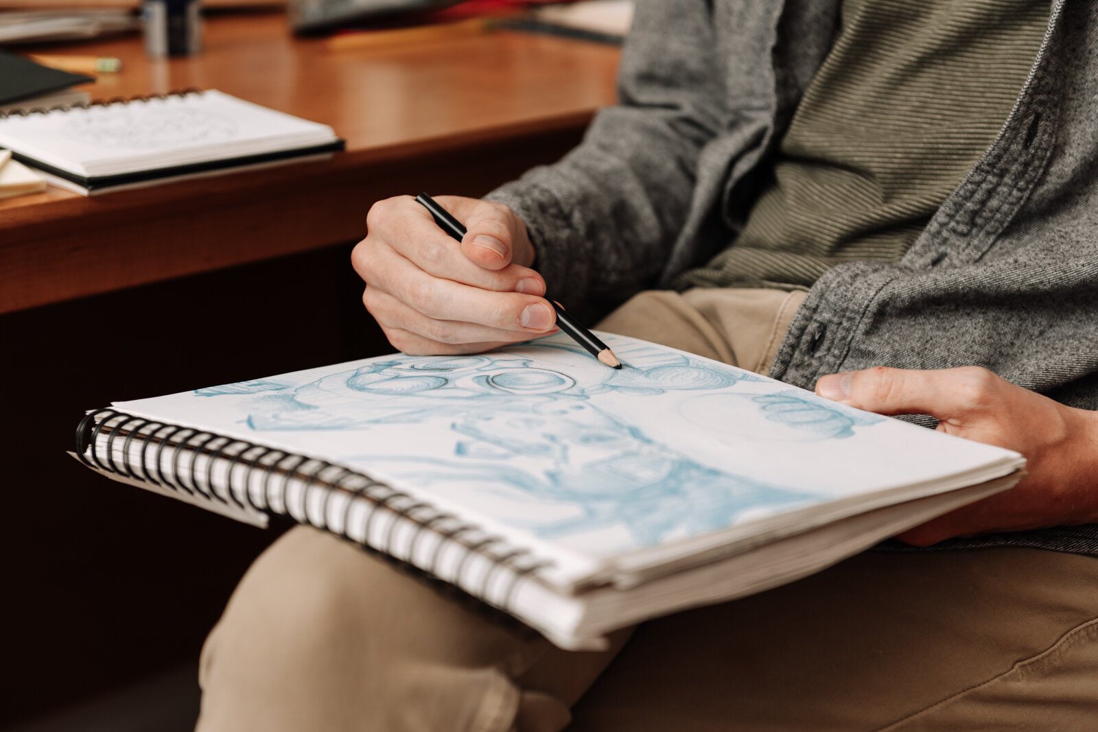 Artist James Newton works on sketching a picture book concept at his home studio in Roanoke.