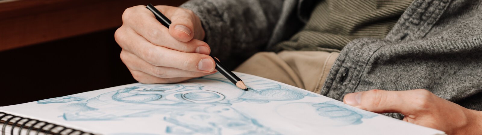 Artist James Newton works on sketching a picture book concept at his home studio in Roanoke.