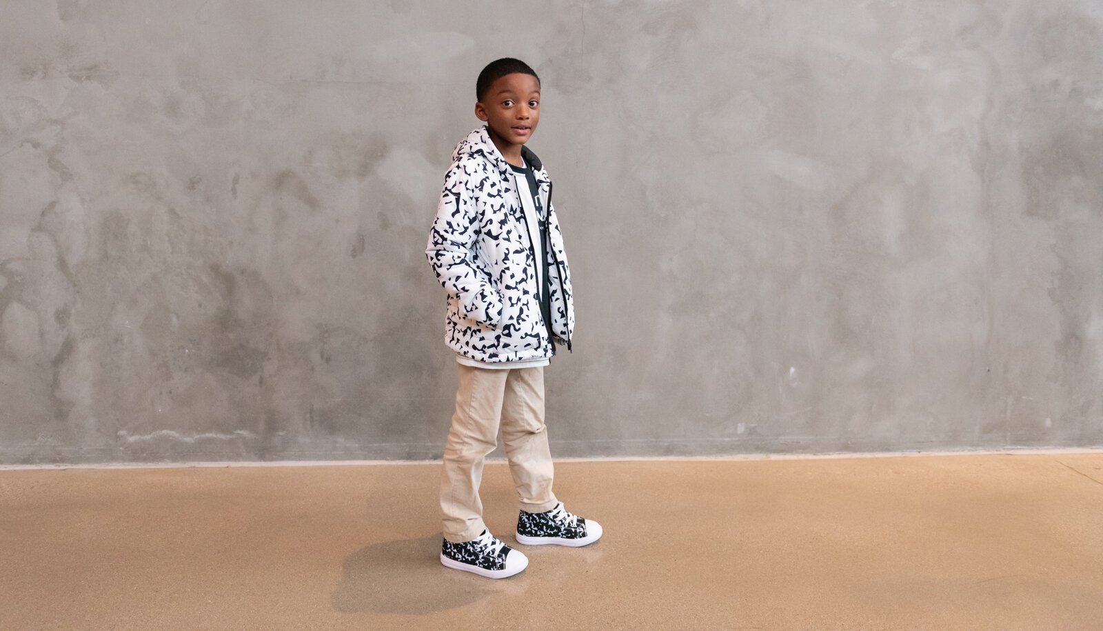 Ja'Maire Frison, 7, models clothing items from Push for Progress' White Out Composition Collection.