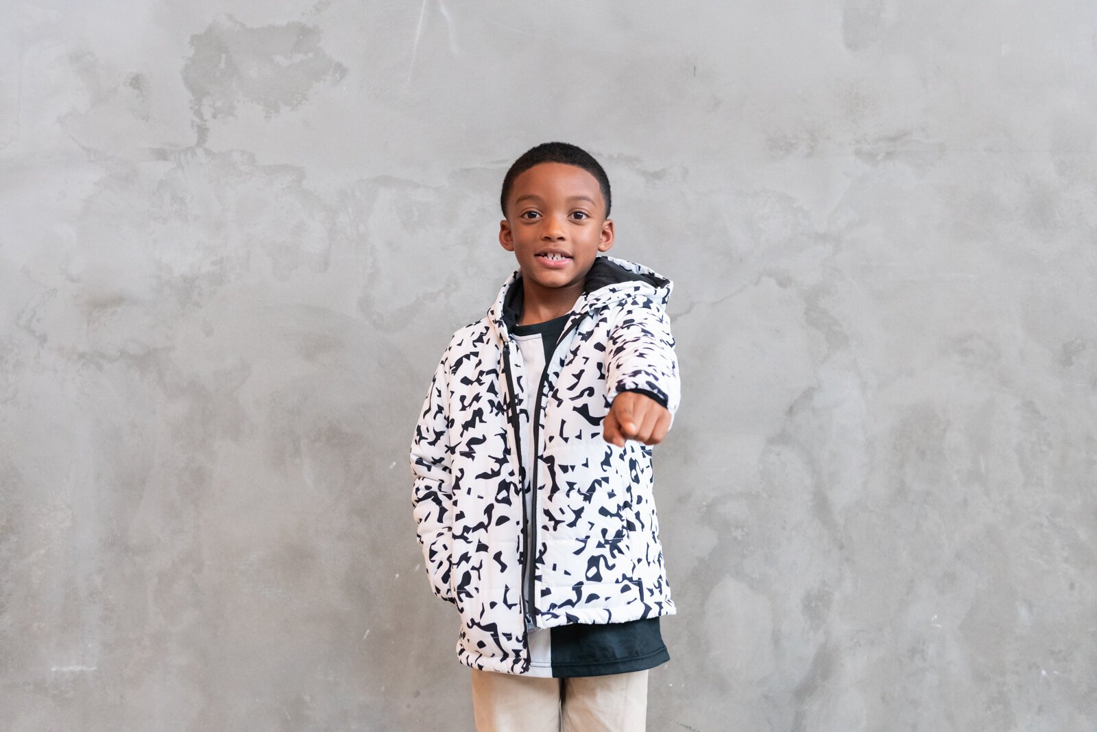 Ja'Maire Frison, 7, models clothing items from Push for Progress' White Out Composition Collection.