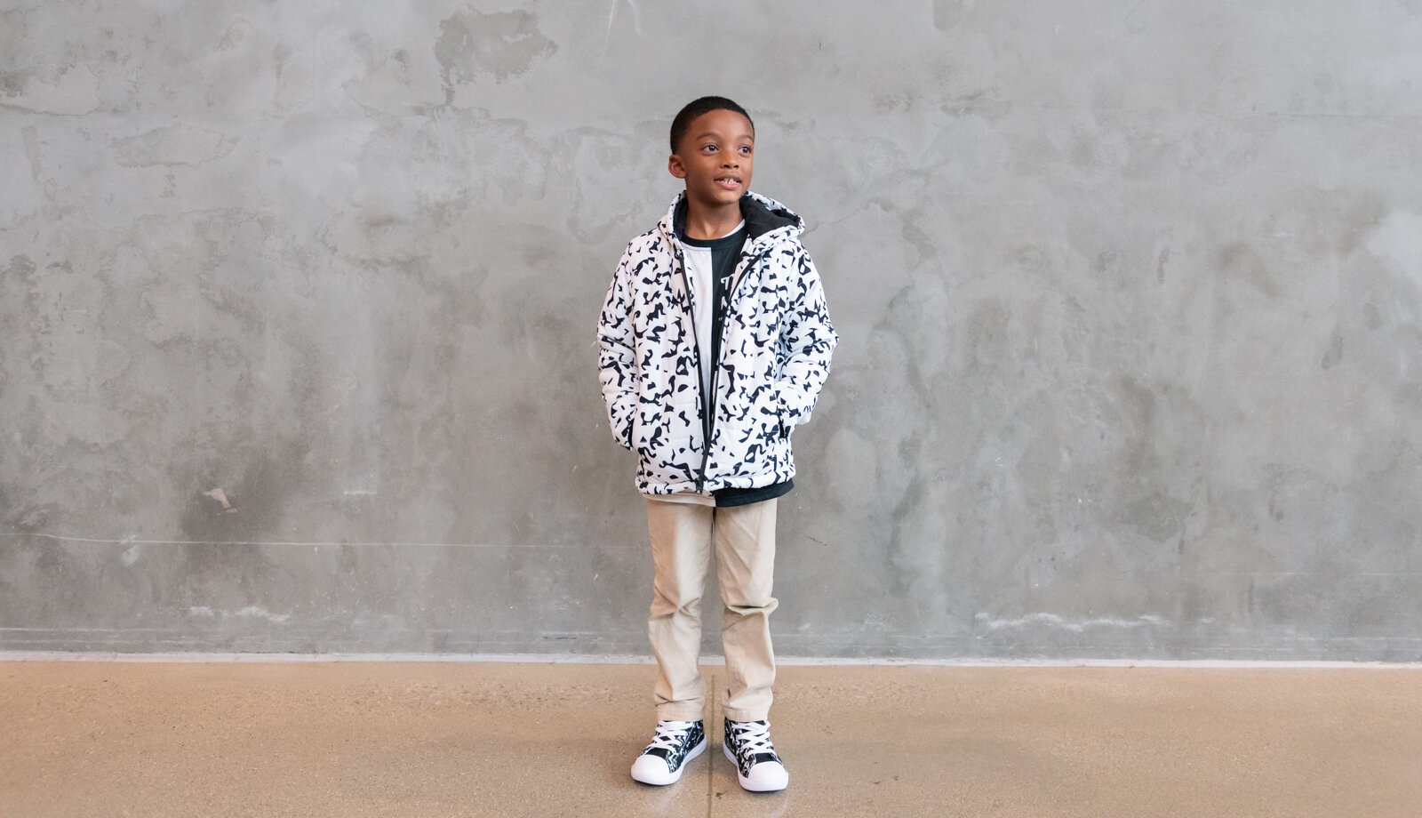 Ja'Maire Frison, 7, models clothing items from Push for Progress' White Out Composition Collection.