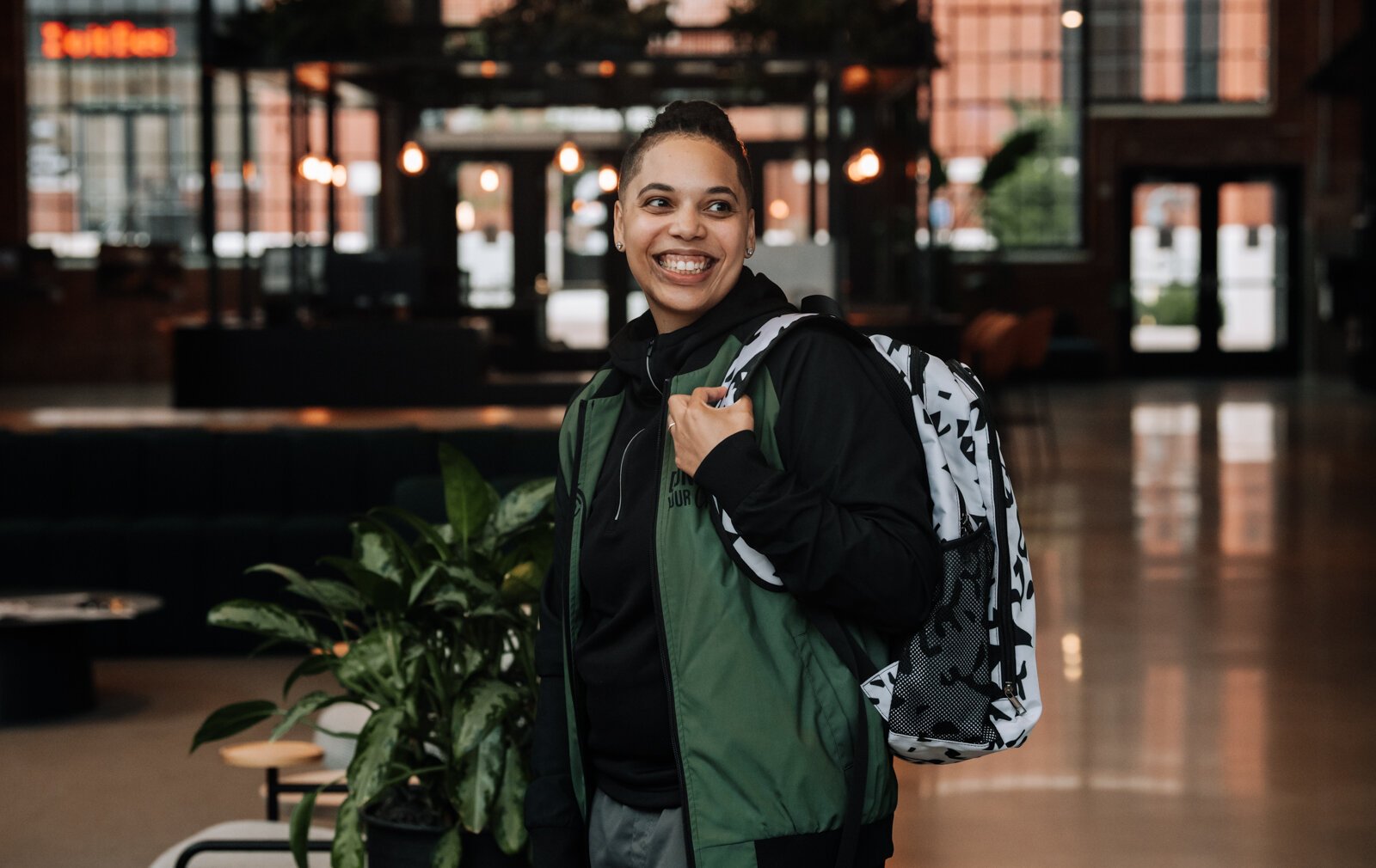 Tori Grieser, founder of Push for Progress, models the sports backpack.