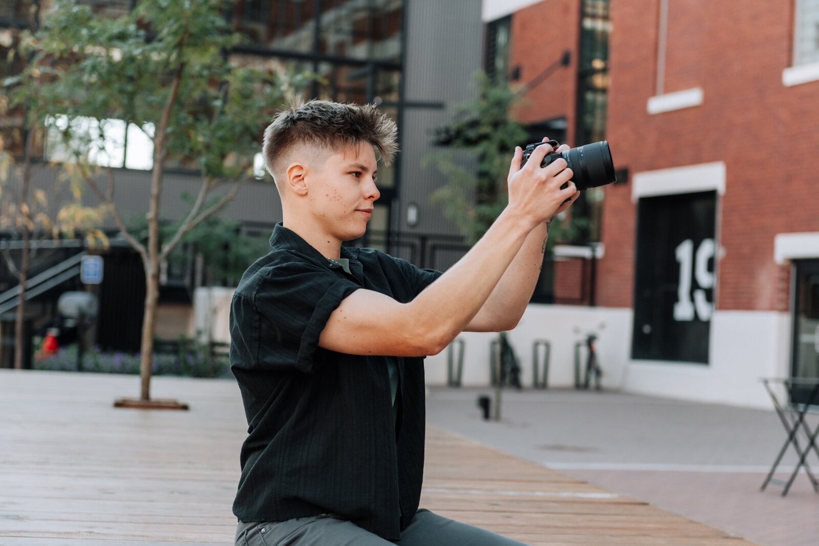 Content creator McKayla Nevers takes a photo at Electric Works.