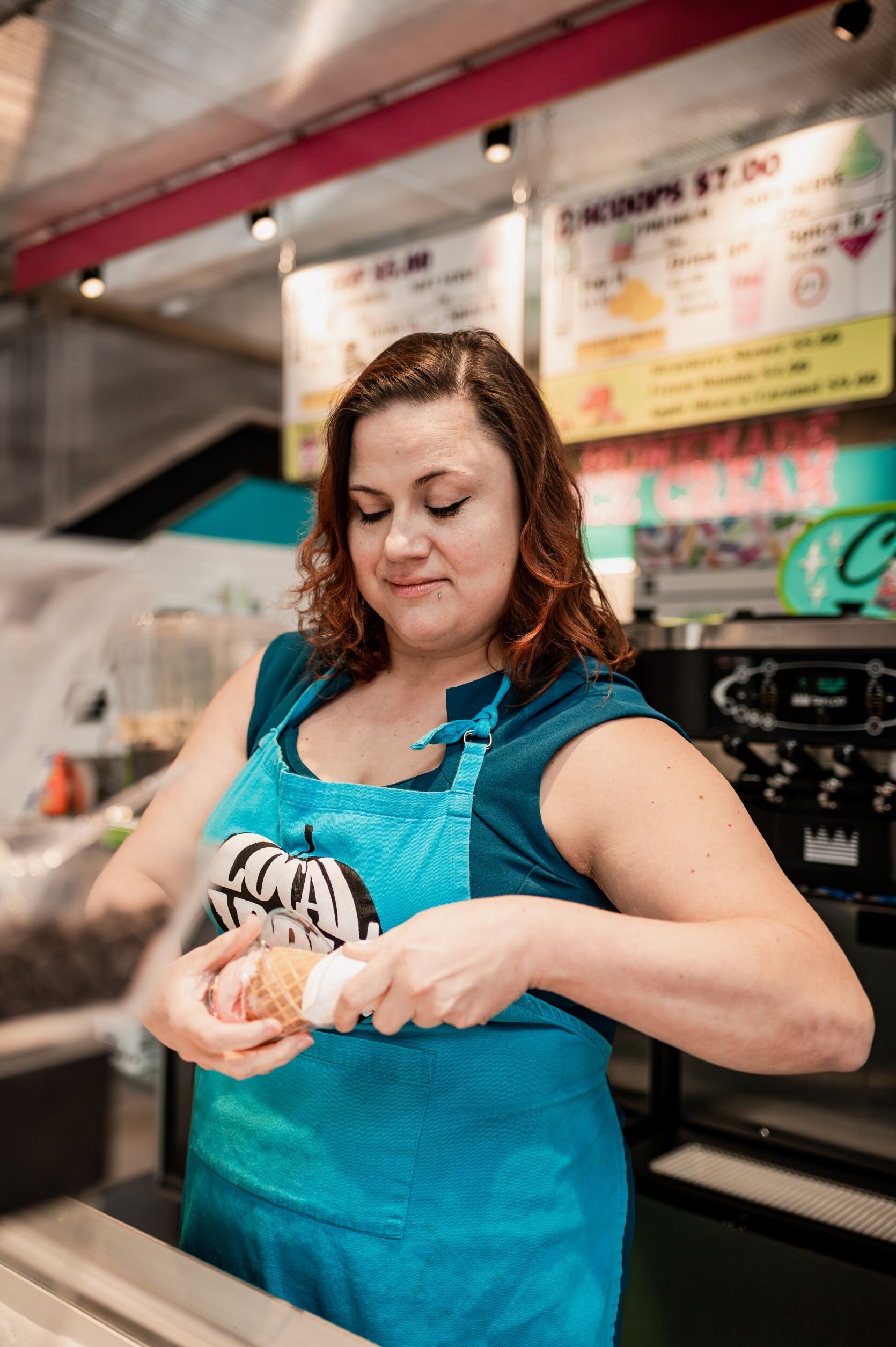 Rachel Nally, owner of Local Apple Cart, makes an ice cream cone.