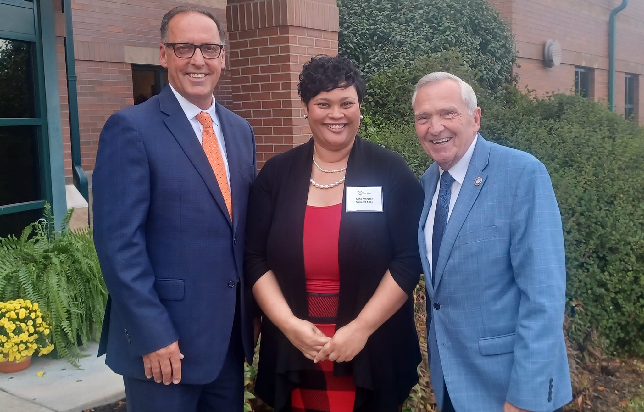 Aisha Arrington with mayoral candidates Tom Didier and Tom Henry.