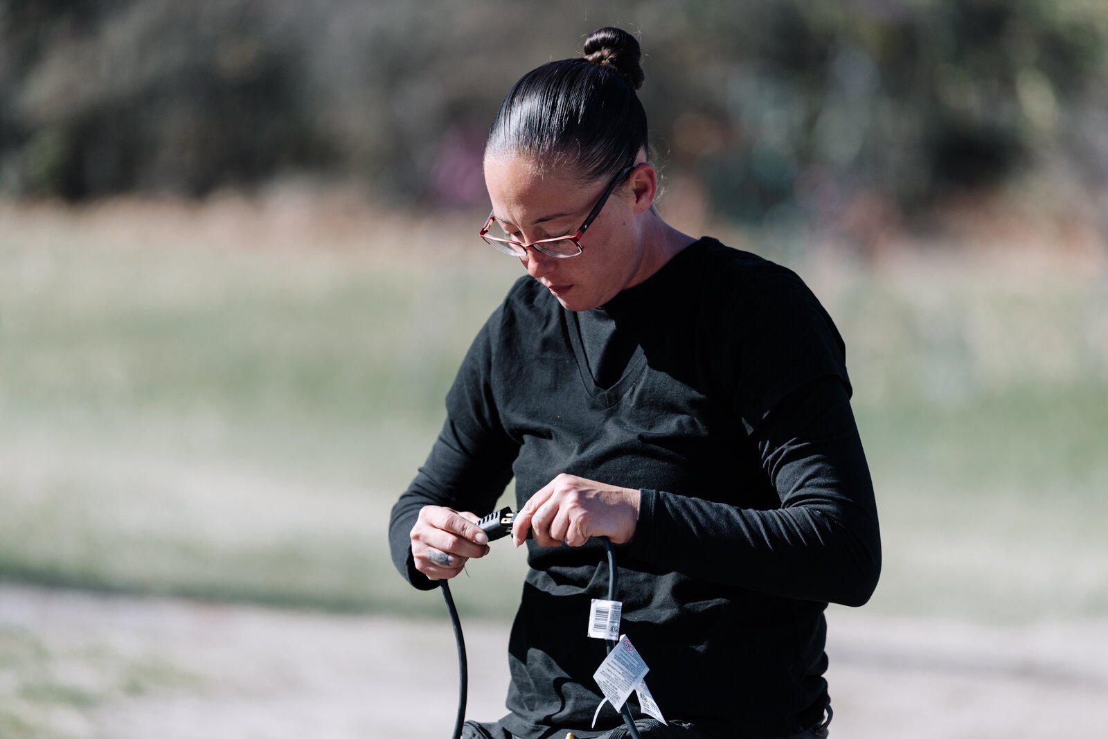 Amanda Lapham works on setting up lights during her shift at Blue Jacket's Fantasy of Lights at Franke Park.