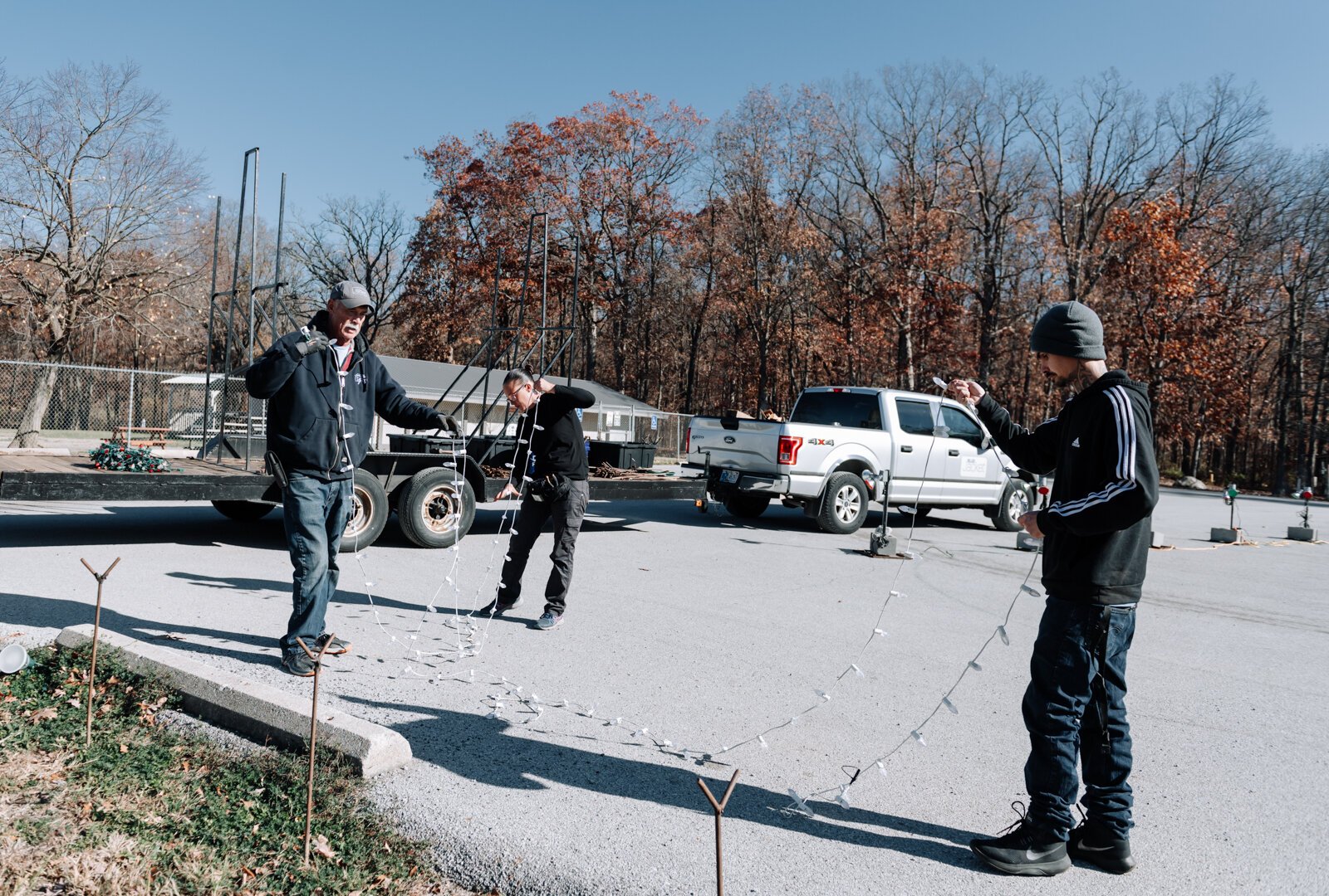 From left: Field Team Supervisor Tom West, Amanda Lapham, and Tyler Dare work together while setting up lights at Blue Jacket's Fantasy of Lights at Franke Park on November 8, 2024.