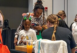 While walking through the Girl Scouts' STEM Expo, attendees see interactive demos and speak with women who work in STEM.