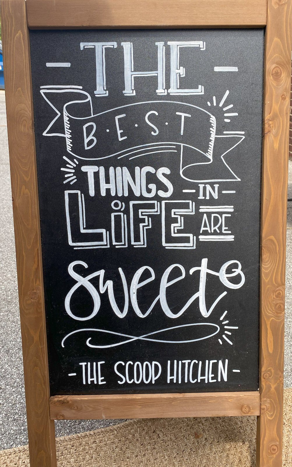 A sign outside The Scoop Hitchen.