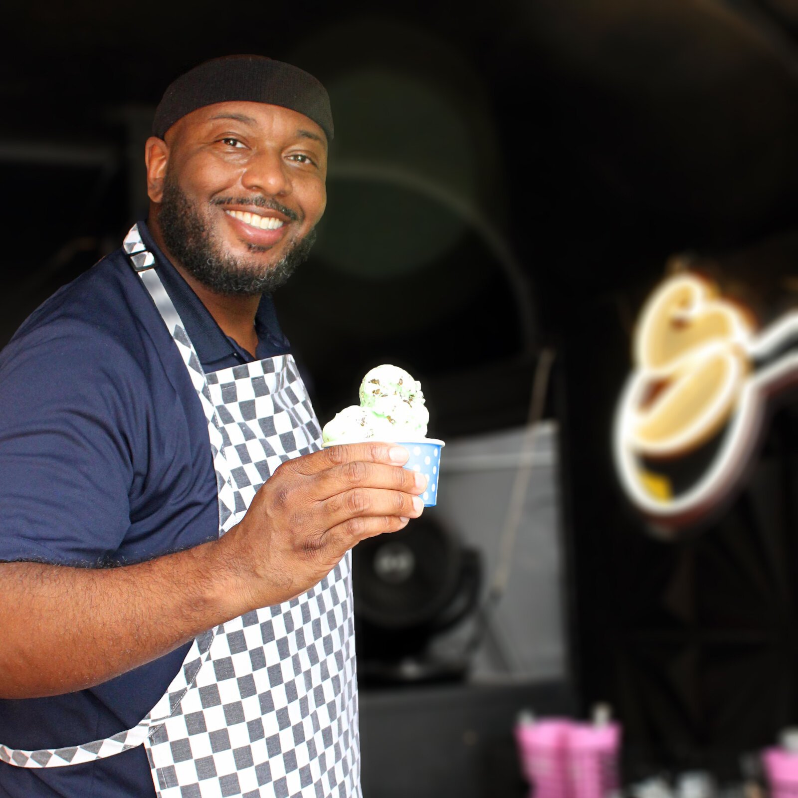 Tony Belton, owner of Classic City Creamery and The Scoop Hitchen, serves ice cream at Brightpoint's ice cream social.