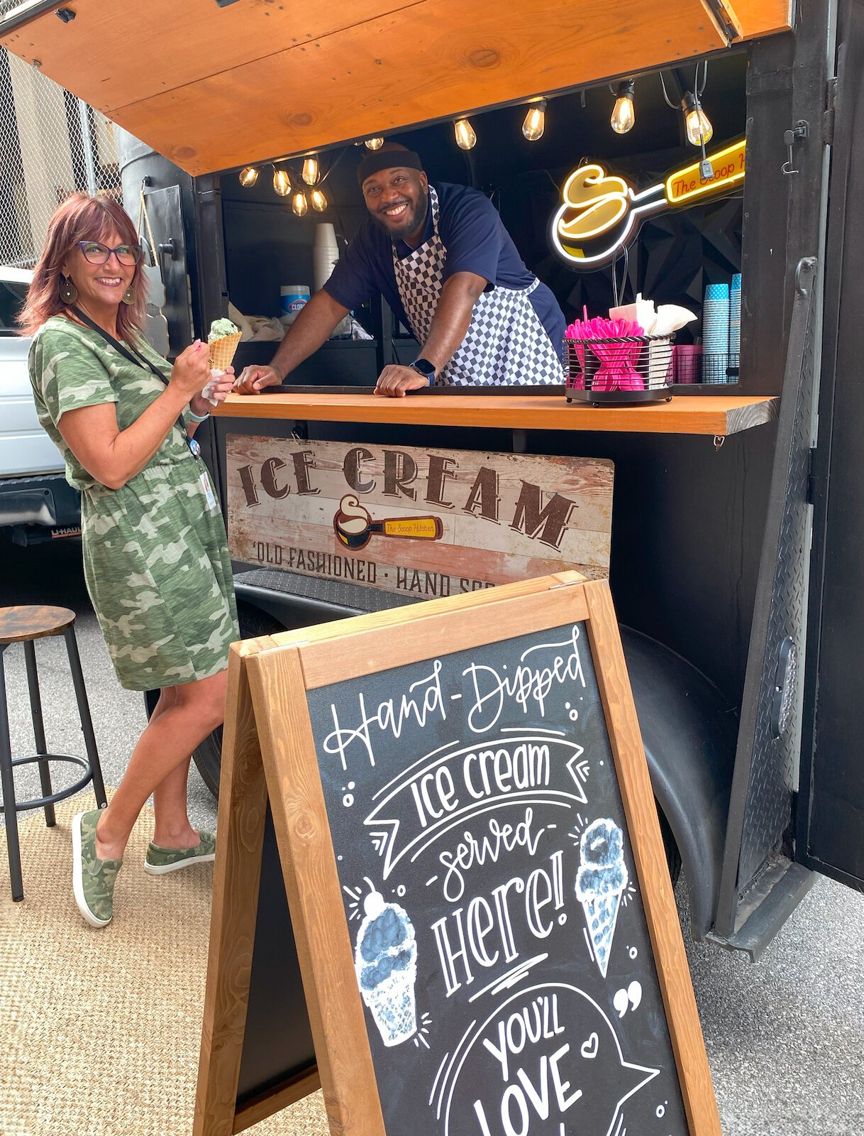 Tony Belton, owner of Classic City Creamery and The Scoop Hitchen, serves ice cream at Brightpoint's ice cream social.